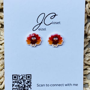May include: A pair of turkey-themed stud earrings on a white card with the text "JCloset" and a QR code with the text "Scan to connect with me".