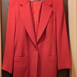 Red JH Collectibles wool suit jacket blazer size 10. This jacket is 100 percent pure wool and fully lined. Made in USA.