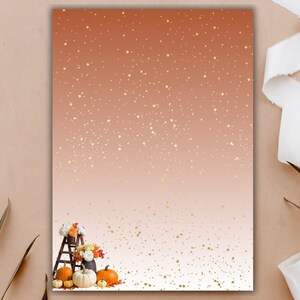 May include: A rustic wooden ladder with pumpkins and fall flowers on a peach and white ombre background with gold glitter.