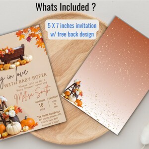 May include: A 5x7 inch invitation for a baby shower with a fall theme. The invitation features a wooden manger with pumpkins and fall leaves. The text on the invitation reads "Falling in love with Baby Sofia".