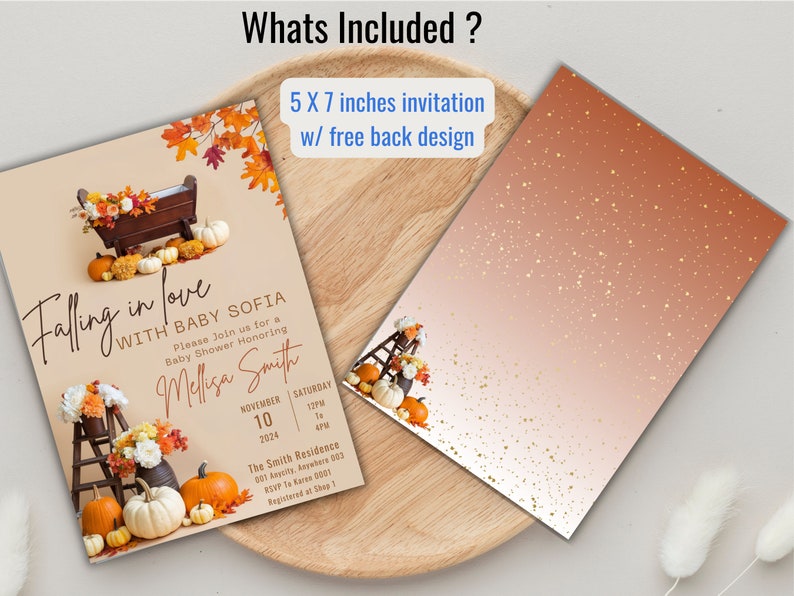 May include: A 5x7 inch invitation for a baby shower with a fall theme. The invitation features a wooden manger with pumpkins and fall leaves. The text on the invitation reads "Falling in love with Baby Sofia".