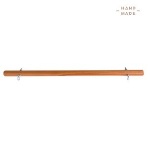 May include: A handcrafted wooden bar with metal eyelets at each end. The bar is a warm brown colour and has the words "HAND MADE" printed in the upper right corner.