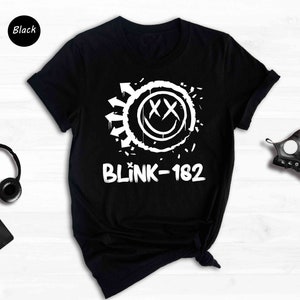 a black shirt with a white logo and headphones