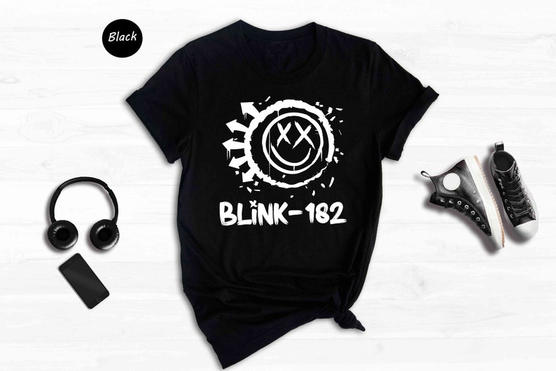 a black shirt with a white logo and headphones