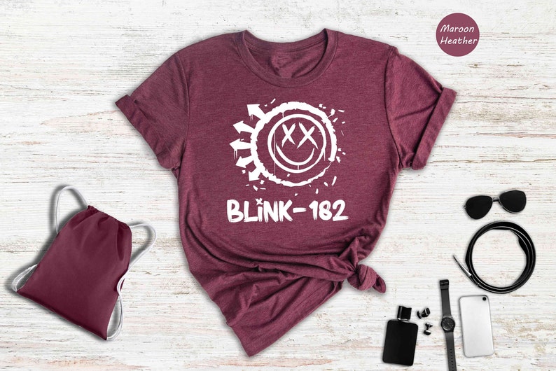 a t - shirt with the word blink - k - 12 on it next to