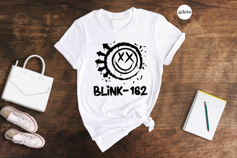a white shirt with a black and white logo on it