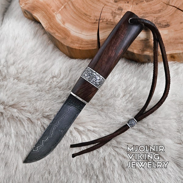 Damascus steel viking knife with sterling silver viking ring and Ironwood handle.