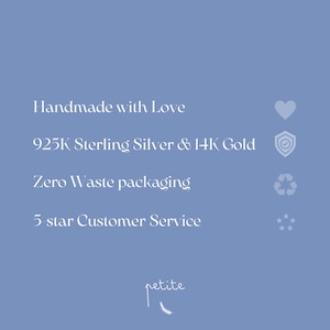 May include: A blue background with white text that reads "Handmade with Love", "925K Sterling Silver & 14K Gold", "Zero Waste packaging", and "5-star Customer Service".  There are icons next to each phrase: a heart, a shield, a recycling symbol, and five stars.