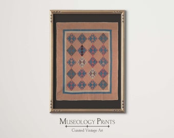 May include: A framed print of a vintage quilt with a geometric pattern in shades of pink, blue, and gray. The quilt is surrounded by a dark brown mat and a gold frame. The text "Museology Prints" and "Curated Vintage Art" is printed below the frame.