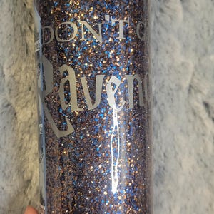 Cute Ravencrap glitter tumbler with vinyl