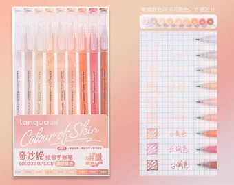 May include: Set of ten skin tone colored fine-tip markers in a clear plastic case. The markers are labeled "Colour of Skin" and "奇妙绘绘画手账笔". The caps of the markers are color-coded to match the ink color.