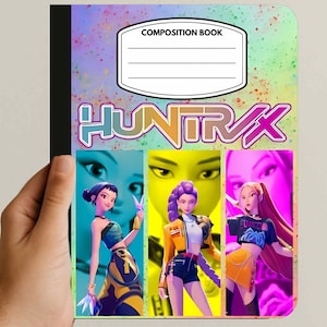 May include: Composition notebook with a colorful design. The cover features the text "HUNTRAX" in orange and pink, and three stylized illustrations of women. The top has a label that says "COMPOSITION BOOK" with lines for writing.