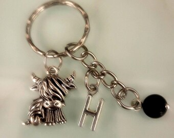 Highland cow keyring/keychain with initial and obsidian ball.