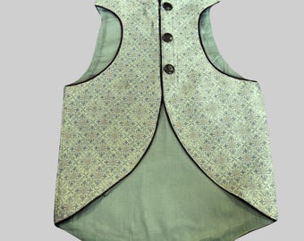 May include: A green sleeveless waistcoat with a floral pattern and black trim. The waistcoat has a mandarin collar and a button closure.
