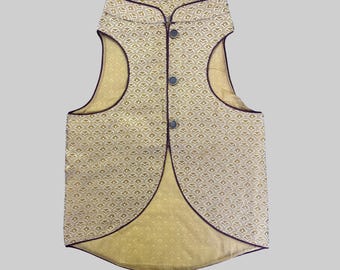 May include: A gold sleeveless waistcoat with a geometric pattern and a burgundy trim. The waistcoat has a mandarin collar and a button closure.