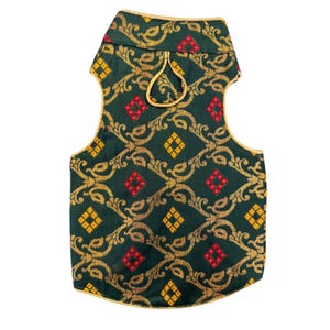 May include: A sleeveless waistcoat in dark green fabric featuring a repeating gold paisley pattern and small red and yellow diamond-shaped accents. The garment has a high collar, gold piping along the edges, and a small gold loop at the neckline.