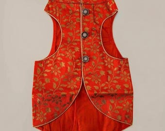 May include: Red sleeveless waistcoat with a gold floral pattern and gold buttons. The waistcoat has a mandarin collar and a pointed hem.