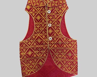 May include: A red sleeveless waistcoat with a gold patterned design and gold buttons.