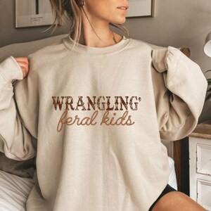 Wrangling Feral Kids Png, Western Shirt, Funny Mom Shirt, Western Mama Png, Feral Kids Png, Raccoon Shirt, Funny Kids Png, Country Mom Png