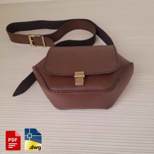 Könnte beinhalten: Eine braune Leder-Umhängetasche mit einem goldenen Verschluss und einem verstellbaren schwarzen Riemen. Die Tasche hat eine sechseckige Form und ist aus hochwertigem Leder gefertigt.