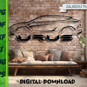 May include: A black and white silhouette of a car with the word "URUS" written below it. The image is on a brick wall background with a couch and a plant in the foreground. The text "ZAJRZYJ TU" is in the upper right corner of the image.