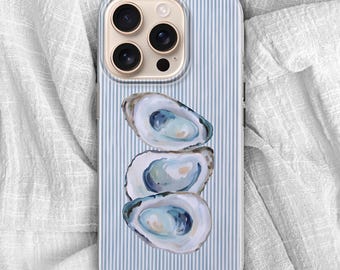 May include: A smartphone case with a blue and white striped background. The case features a watercolor illustration of three oysters stacked on top of each other. The phone case has a gold-colored camera module.