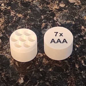 Compact AAA Battery Container- Keep 7 Batteries Secure while traveling.