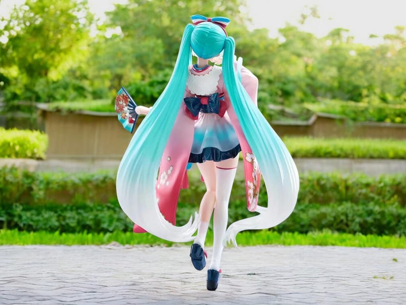 Hatsune Miku kawaii girl figure displayed with other anime collectibles