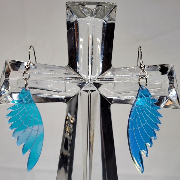 Angel wing blue/purple holographic/reflective two sided earrings. Nickel free earring hoops with rubber backs.