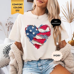 May include: A white ceramic mug with a black handle and the text "But First, Coffee" in a black, handwritten-style font. The mug is on a white surface.