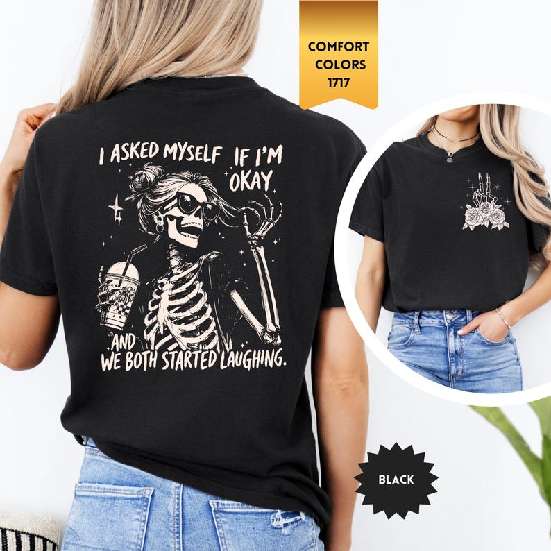 May include: Black t-shirt with a skeleton graphic wearing sunglasses and holding a drink, with the text "I asked myself if I'm okay, and we both started laughing." A smaller image shows a peace sign with roses.