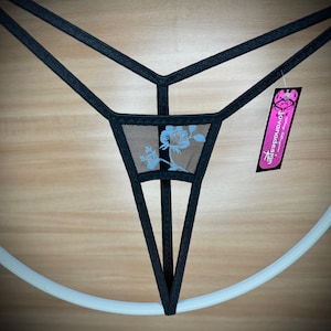 May include: Black lingerie with a floral design and a tag that says "Jovanadesign".