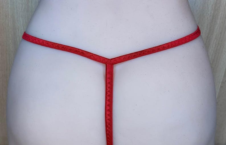 May include: Red lingerie with a thin strap design.