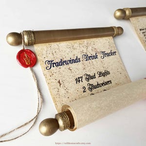 May include: A scroll-style drink tracker with the text "Tradewinds Drink Tracker." The scroll is made of parchment-like paper and has gold-colored wooden dowels. A red wax seal with a gold emblem hangs from the scroll.