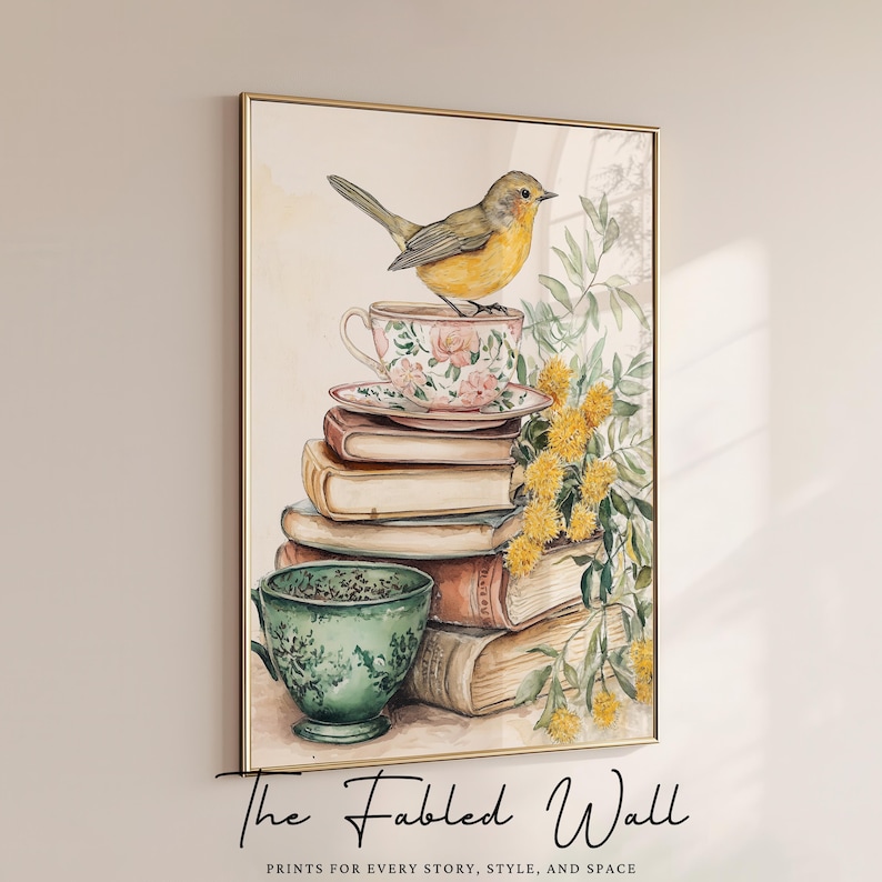A whimsical printable art print featuring a yellow songbird perched atop a floral teacup, resting on a charming stack of vintage books with a green teacup beside it and sprigs of yellow wildflowers—perfect for cozy cottagecore or book-themed decor.