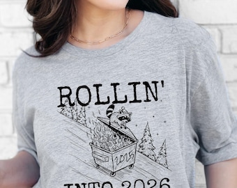 Rollin' Into 2026 T-Shirt, Funny Dumpster Fire Raccoon Shirt, New Year's Eve Gift