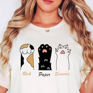 Chemise drôle de ciseaux de papier de roche de patte de chat, t-shirt graphique de chaton mignon, cadeau d'amant de chat, T-shirt drôle de propriétaire d'animal de compagnie, chemise de meme de chat, t-shirt de chat unisexe