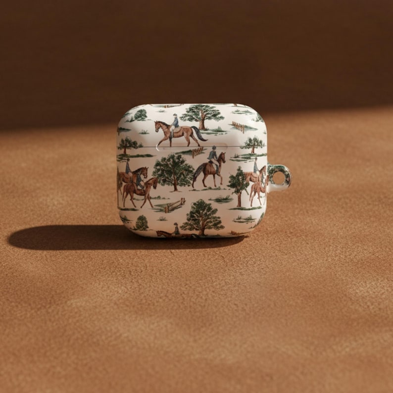 Protective AirPods Case Horse Design Pattern Equestrian Style Cover Scratch Resistant Polycarbonate Material Gloss Finish Detail Carabiner Attachment Included Slim Lightweight Construction Horse Girl Gift Idea Country Aesthetic Appeal Cream