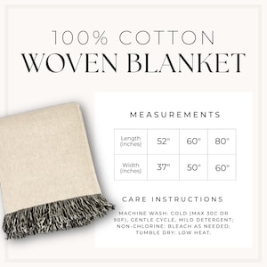 May include: A 100% cotton woven blanket in a light beige colour with dark fringe. The image includes a measurement chart listing lengths of 52, 60, and 80 inches and widths of 37, 50, and 60 inches, plus care instructions for machine washing.