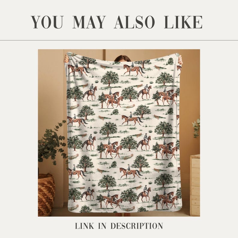 May include: A cream-colored blanket featuring a repeating pattern of riders on horseback and trees. The blanket has the text "YOU MAY ALSO LIKE" at the top and "LINK IN DESCRIPTION" at the bottom.