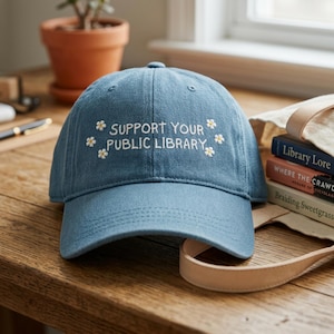 May include: A set of three ceramic mugs with a speckled, matte finish. Each mug features a different color: light blue, cream, and gray. The mugs have a simple, modern design and a comfortable handle.
