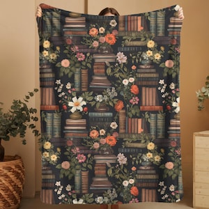 Dark Academia Vintage Library Blanket Book Pattern Throw Cozy Reading Accessory Velveteen Plush Material Dark Background Design Stacked Books Illustration Colorful Floral Accents Multiple Size Options Machine Washable Polyester Book Lover Essential Home
