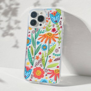 May include: A clear phone case with a colorful floral design. The case features a variety of flowers, leaves, and stems in shades of red, orange, yellow, green, blue, and purple.
