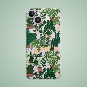 Puede incluir: Una funda transparente para teléfono con un patrón de plantas verdes en macetas. La funda tiene un recorte para el objetivo de la cámara.