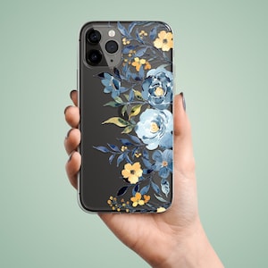 Clear phone case with an illustrated flowers composition. The leaves and the flowers are in the shades of blue and yellow. The preview shows the case on a black iPhone device.