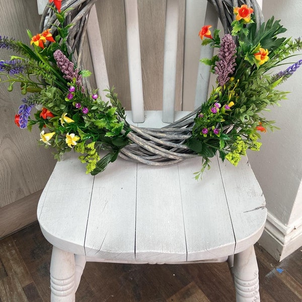 Artisan spring floral wreaths with real wicker base.