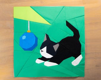 Bauble Hunter Kitty Quilt Block Pattern 14x14" Foundation Paper Piece FPP tuxedo cat playing with Christmas ornaments on a tree