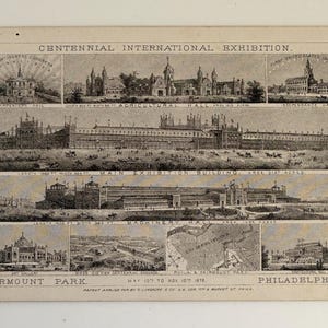 May include: A white ceramic mug with a black handle and the text "But First, Coffee" in a black, bold font. The mug is on a white surface.