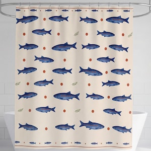 May include: Beige shower curtain with a repeating pattern of blue fish, red dots, and small green sprigs. The curtain has a brown border at the top and bottom, and is designed to hang from a curved metal rod.