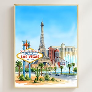 Op de afbeelding: Een ingelijste print met een aquarel illustratie van de skyline van Las Vegas. De afbeelding toont de Eiffeltoren, het "Welcome to Fabulous Las Vegas" bord, palmbomen en een blauwe lucht. Het kunstwerk is ingelijst in een licht houten frame.